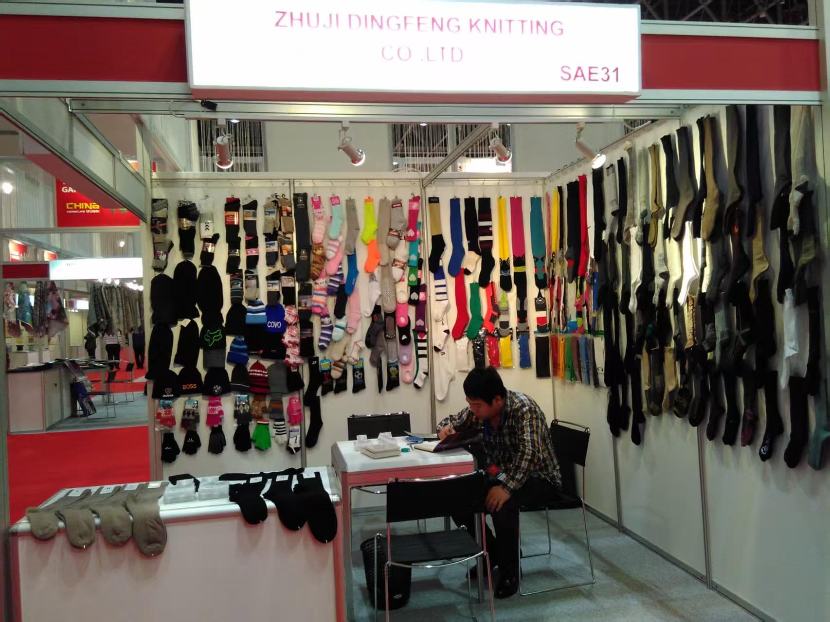 CustomizeSocks trade show booth with sock samples on display