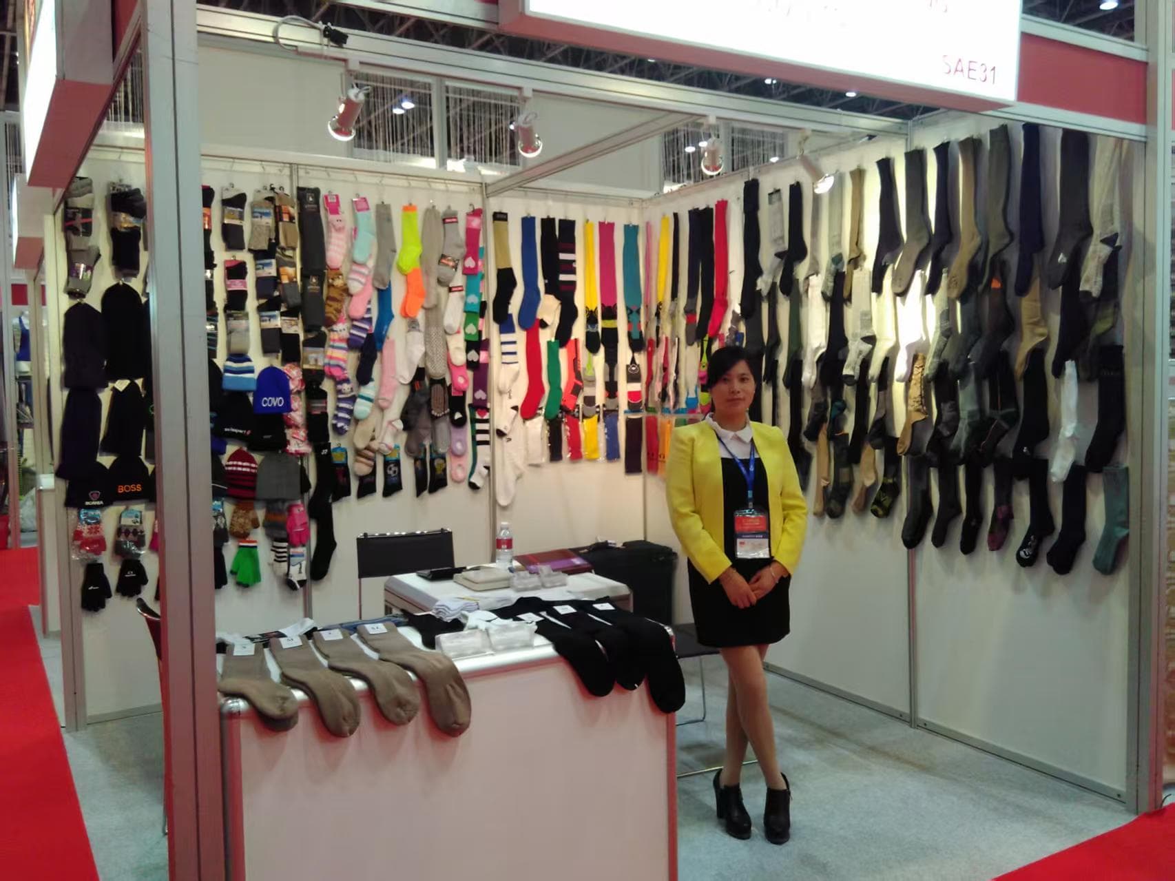 CustomizeSocks team member at the company trade show booth